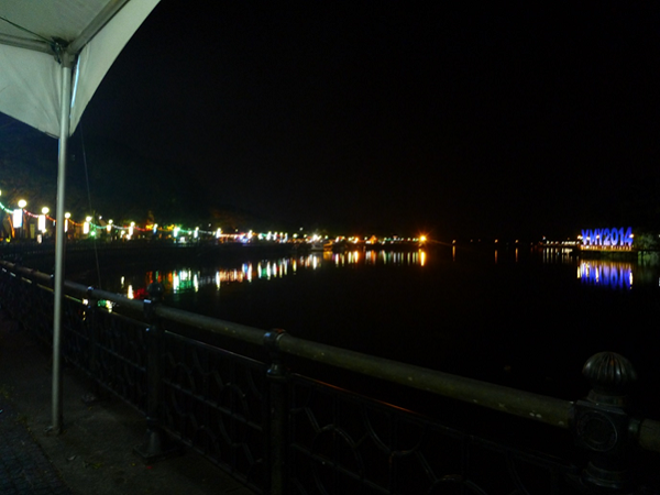 View up the river flowing through Kuching with the government building on the right 