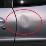 Photo of a dent in a car door