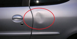 Photo of a dent in a car door