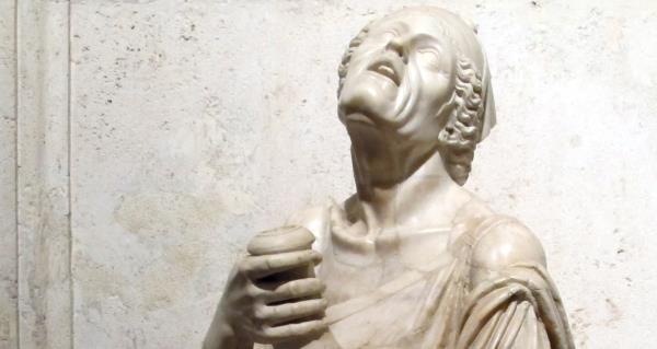 Sculpture of drunken beggar