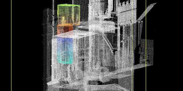 a grey laser scan of a building with a multicoloured section over two floors