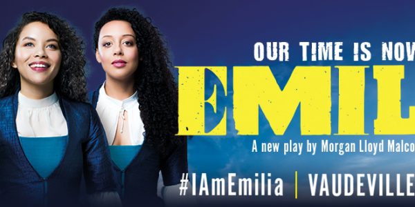Three women dressed in blue next to the title 'Emilia'