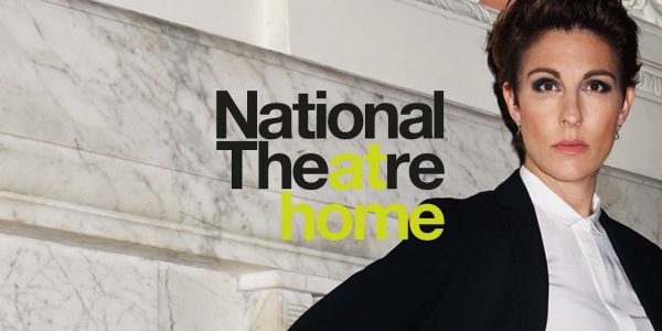A woman standing next to the words 'National Theatre At Home'