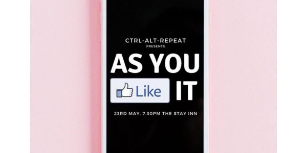 A phone showing the text 'As You Like It' on a smartphone.
