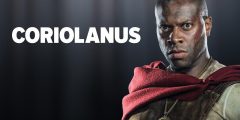 A Black man stands in front of the word Coriolanus