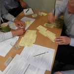 A photograph of the main modelling exercise; stakeholders discussing catchment objectives