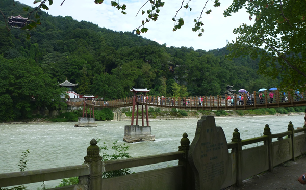 A photograph of a rope swing bridge over the 2000 year old diversion channel, Chengdu, China