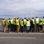 A photograph of the CWFA team at Newcastle Great Park development site, looking at SuDS