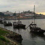 A photograph of port boats on the Douro River.
