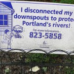 A photograph of a sign showing that the owner of the house has disconnected their downspouts (drainpipes into the sewer system)