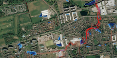 Figure 1 CityCat Simulation of the Granton Ponds for a short duration extreme event. Water depths are shown in blue and velocity vectors in red (© Google maps)