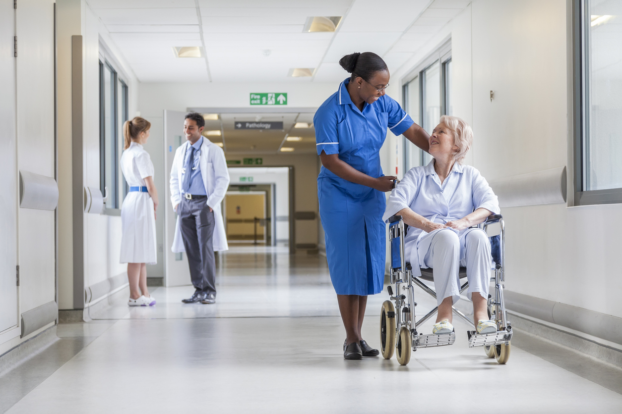 Image of a nurs with patient in a wheelchair