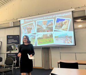 Professor Jillian Rickly standing in front of a large slide - Want to experience the best of Nottingham with the STTAR banner on the left.