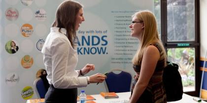Student talking to employer at a careers event.