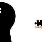 Cartoon image of a professional handing the missing puzzle piece to someone head