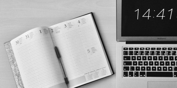 Unfold Book Beside Macbook