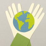 animated image of two hands holding a world.