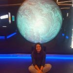 Cristina at the ESA with a giant global in the background