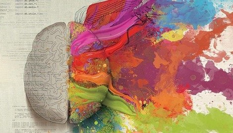 Drawing of a brain. The left half of the brain has writing over it. The right half of the brain has different coloured paint flowing from it.