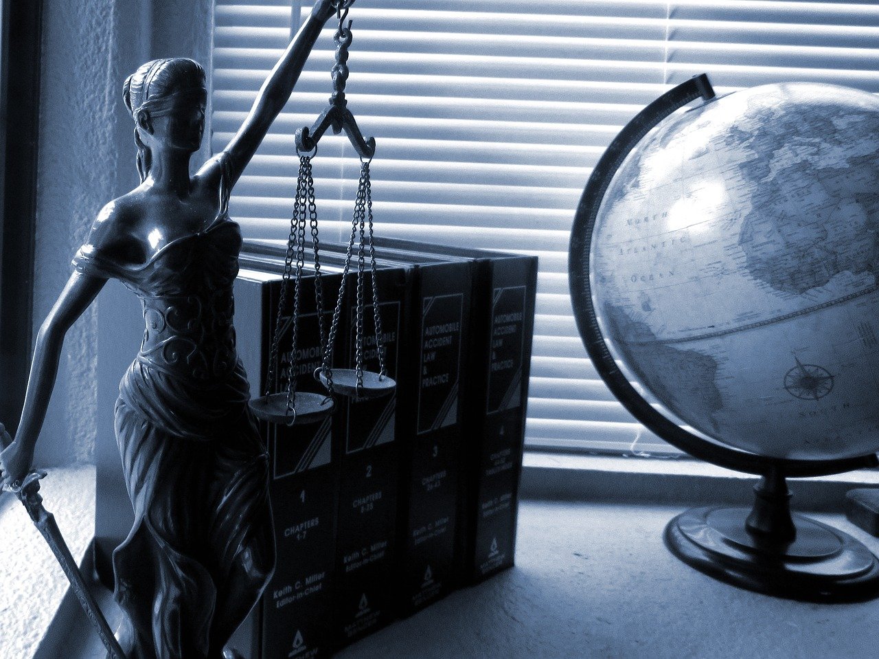 globe, law scales and statue