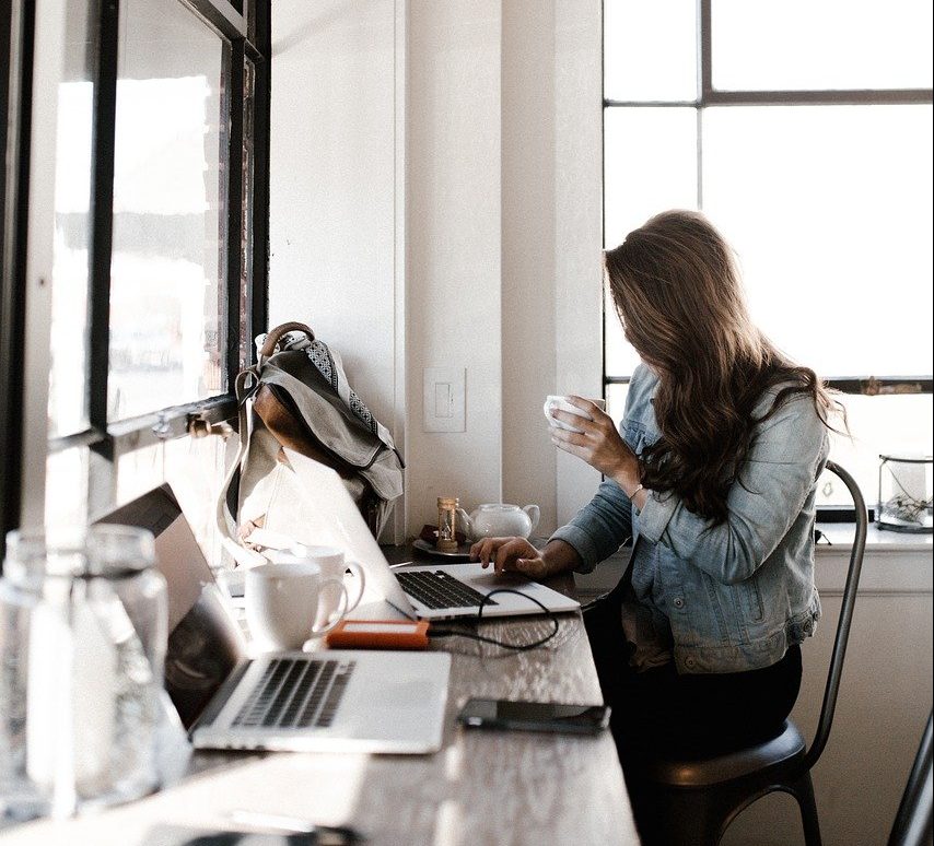 Woman working in modern office on a laptop