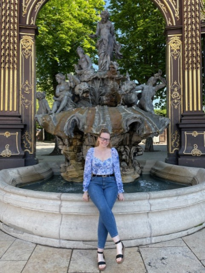 Lauren Ogden in front of a water feature in France