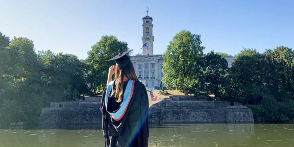 Image of graduate, Saejin Lee, infront of Trent building