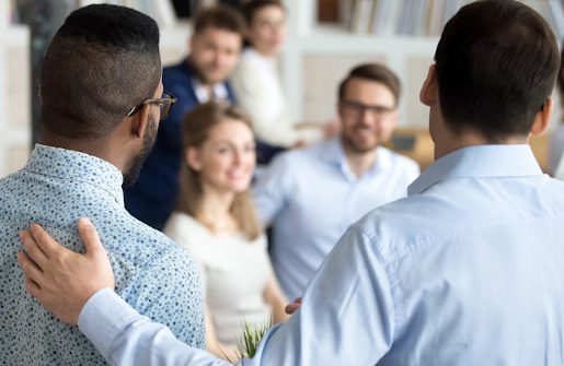 Boss introducing new worker to work colleagues