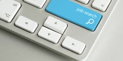 Close up of a Mac keyboard with the text 'job search' on the keys