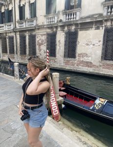 Me standing in front of a gondola in Venice. I used the opportunity to do some exploring within Italy