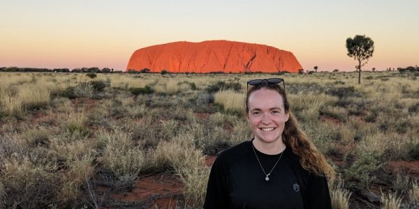 Helen Cridland in front of Ayers Rock