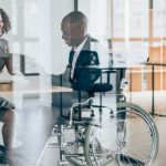 Woman and man in a wheelchair in an interview