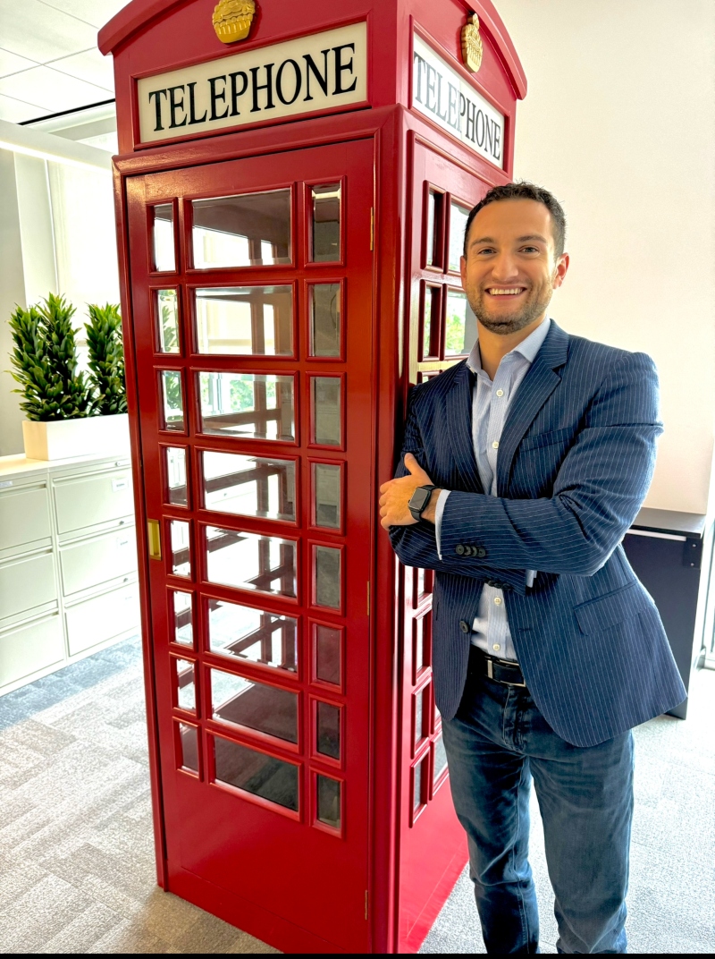 Jackie Saville stood next to a red BT telephone box