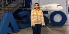 Para Saraiya standing in front of a model plane and A350 logo