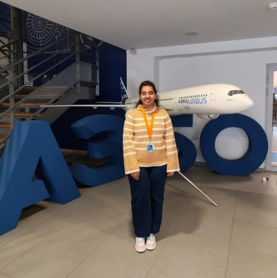 Para Saraiya standing in front of a model plane and A350 logo