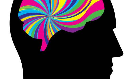 Vector illustration of a male head silhouette with a psychedelic coloured brain on it