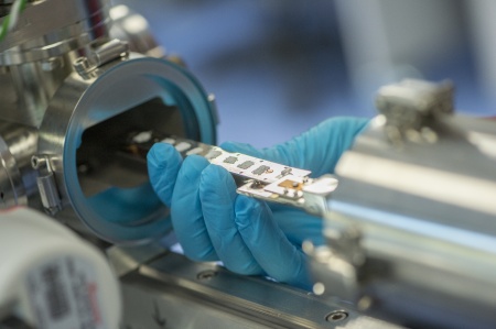 A sample being inserted into an Xray photoelectro spectroscopy (XPS)