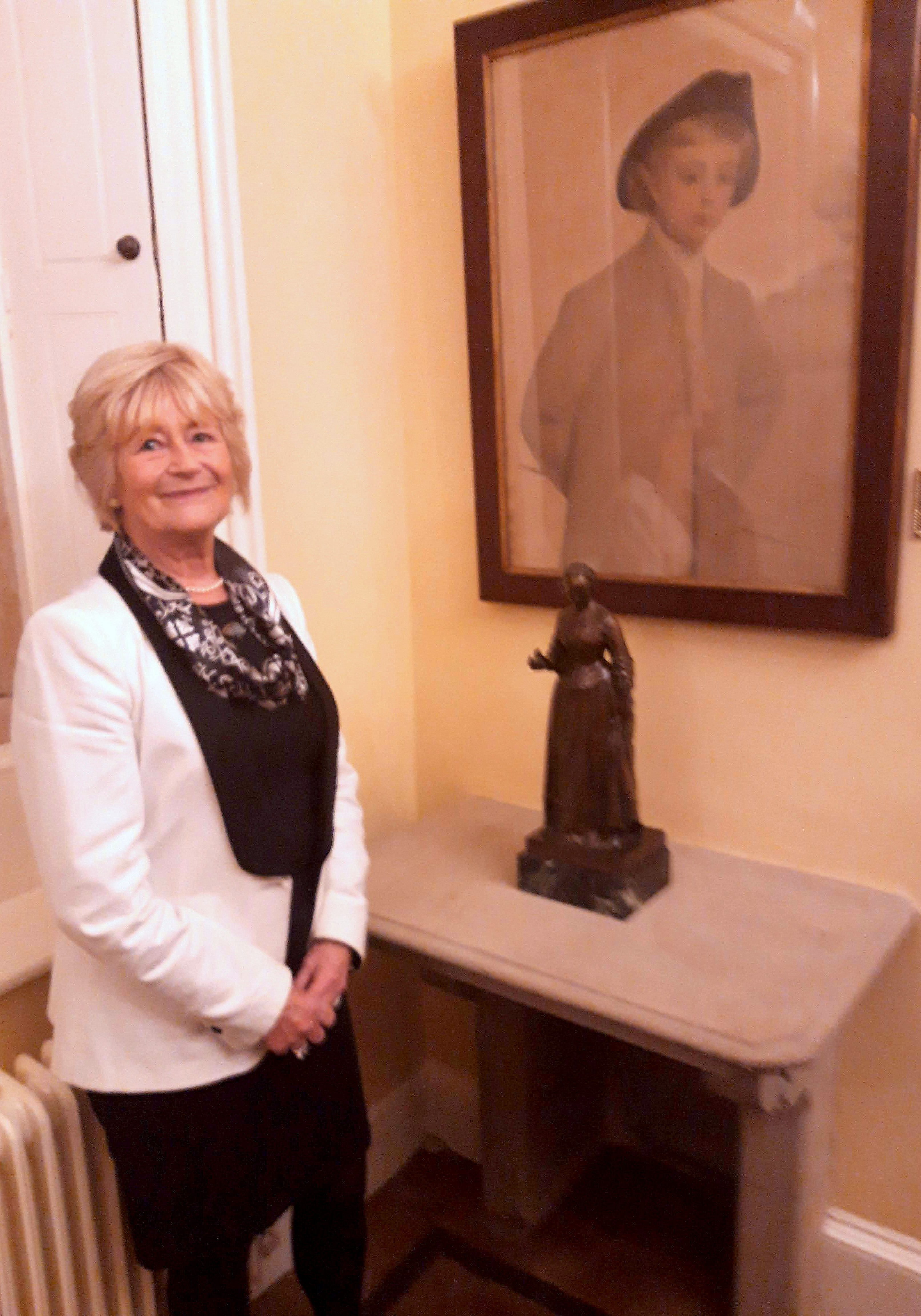 Yvonne Moores standing next to a maquette of Florence Nightingale