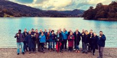 Future Food Director Andy Salter with other attendees of the Rank Prize meeting, standing in front of a lake with clouds in the background