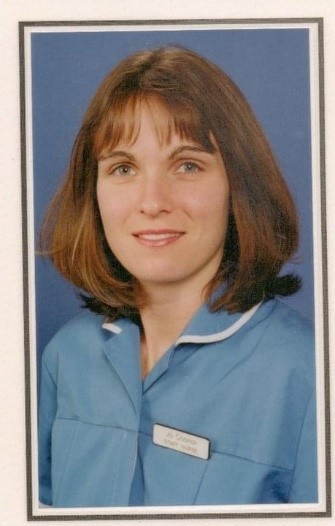 Joanne Cooper in her nurse's uniform smiling at the camera