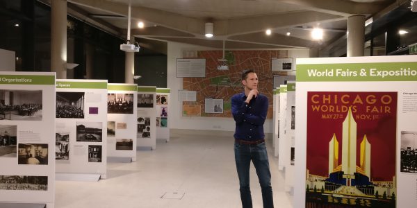 Prof Stephen Legg stands contemplating the "Spaces of Internationalism" exhibition