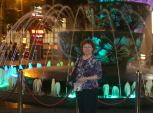 Helen Whitehead by an illuminated fountain in Kuala Lumpur