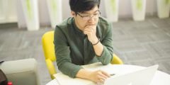 Student studying at a laptop.