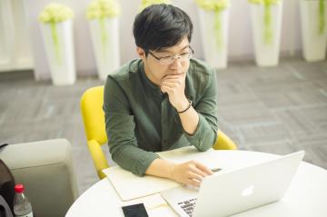 Student studying at a laptop.