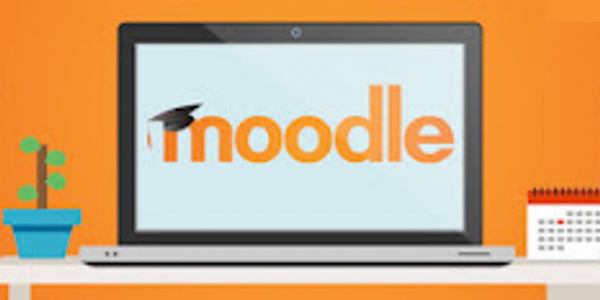 The Moodle logo shown on a laptop screen sitting on a desk.