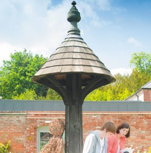 Students reading in the walled garden