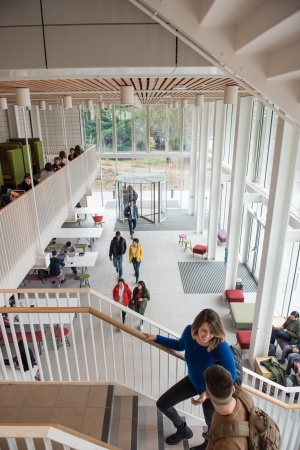 Students walking through the Teaching and Learning Building, University Park