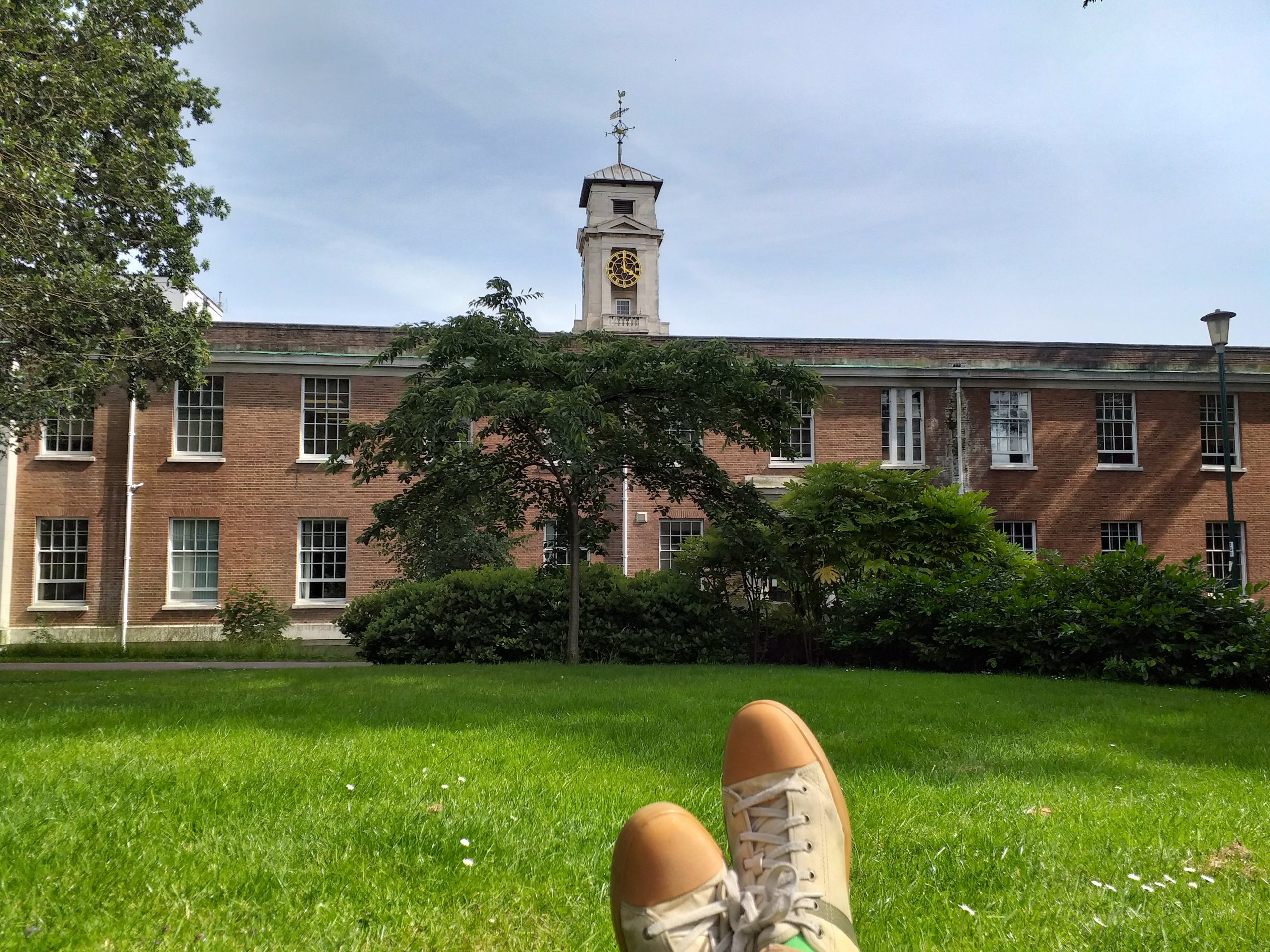 Relaxing on campus with a book!