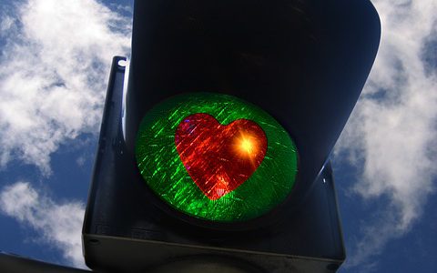 Green traffic light with heart