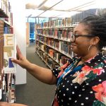 Library Advisor shelving books